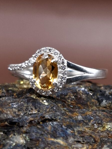 Citrine, white topaz. Silver. Width 1 cm. Size 9.